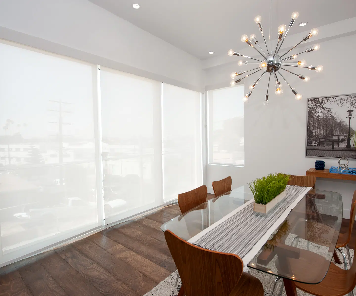 Modern room with roller shades filtering bright window light